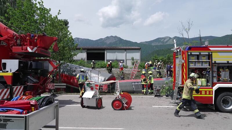 Emergency responders and firefighters work at the scene of a train derailment in Burgrain, near the resort town of Garmisch-Partenkirchen, southern Germany. Photograph: Network Pictures/EPA-EFE