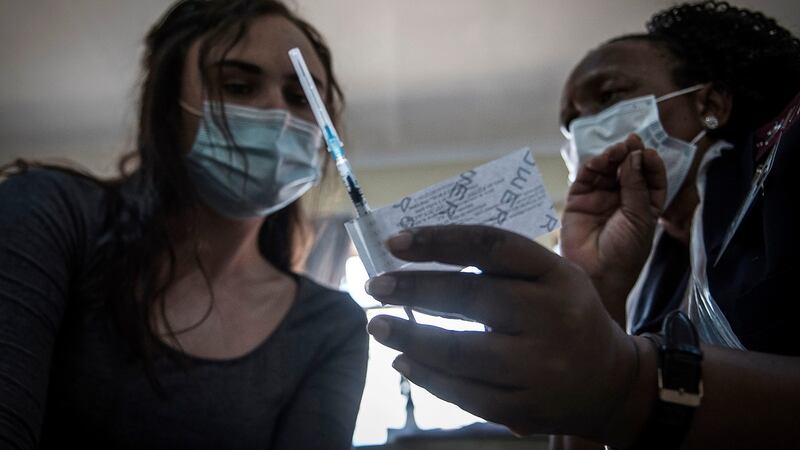 A healthcare worker is shown a Johnson & Johnson Covid-19 vaccine dose at a government hospital in Klerksdorp, South Africa, last month. Photograph: Shiraaz Mohamed/AP