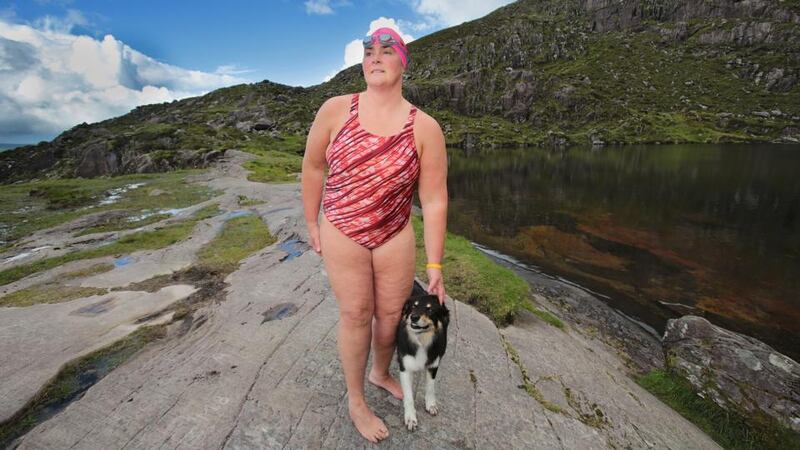 Swimmer Nuala Moore with her dog LG. Photograph: Valerie O’Sullivan