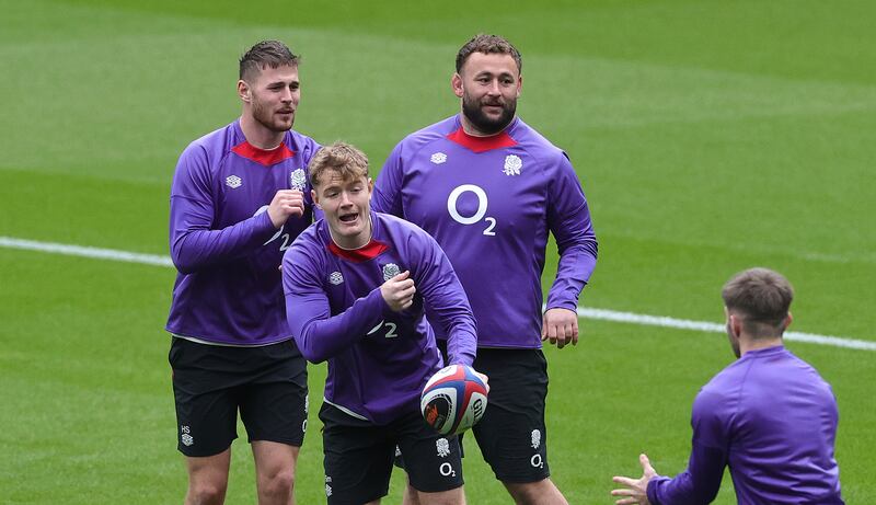 Fin Smith passing the ball during the England captain's run at Twickenham. Photograph: David Rogers/Getty Images