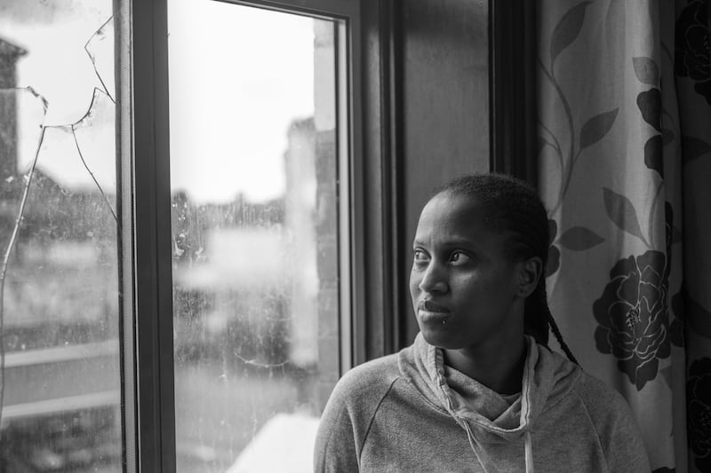 Fatima with broken window, substandard housing, Manor Park, London. "When it rains it leaks through the ceilings, in my room the ceiling is coming down. I’ve taken pictures and sent them to the landlord, but he’s done nothing. There’s no heating, nothing, we have to wear jumpers inside all the time. This has been going on as long as I’ve been living here." Photograph: Marc Davenant