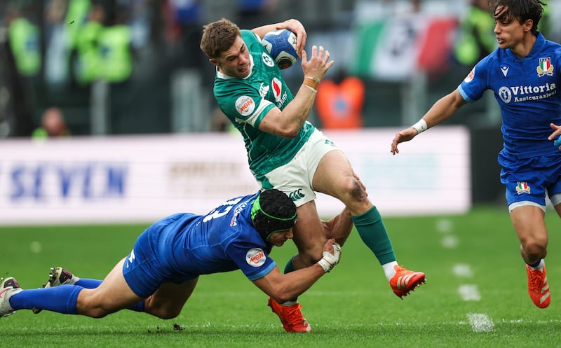 Ireland outhalf Jack Crowley is tackled by Juan Ignacio Brex of Italy during the Six Nations game at Stadio Olimpico. Photograph: Billy Stickland/Inpho