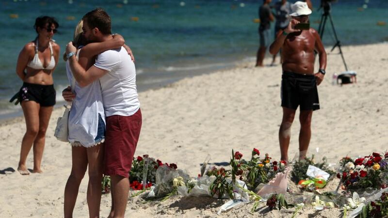 People pay their respects on the beach near the RIU Imperial Marhaba hotel in Sousse, Tunisia, June 30th, 2015. Photograph: Steve Parsons/PA Wire