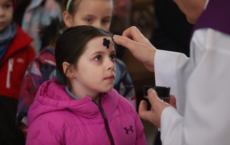 Eight–year–old Dakota Hopkins from the Central Model School, Marlborough Street Dublin, also at the Pro Cathedral today.  She was part of a group of children who will soon be making their First Holy Communion. Photograph: Bryan O’Brien 