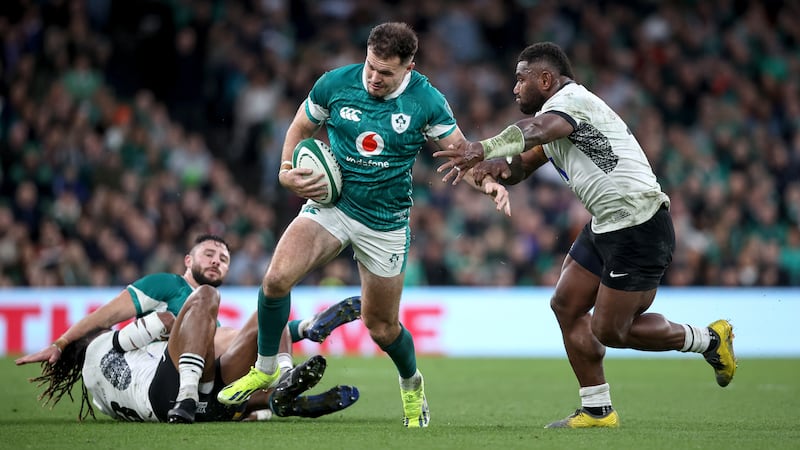 Jacob Stockdale with Fiji's Josua Tuisova. Photograph: Ben Brady/Inpho