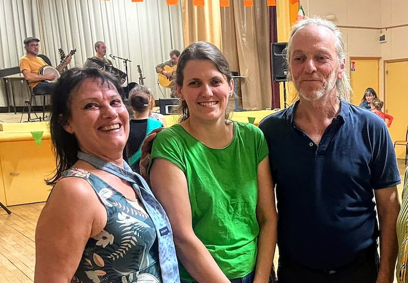 Les Amis de l’Irlande 71 committee members Agnès Sergent, Émilie Renebon and Philippe Mochet at the St Brigid’s Day céilí in Préty. Photograph: Ian Smith