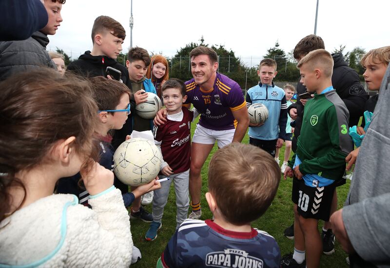 Kilmacud Crokes' Shane Walsh with supporters after the Dublin semi-final victory over Thomas Davis at Parnell Park. Photograph: Bryan Keane/Inpho