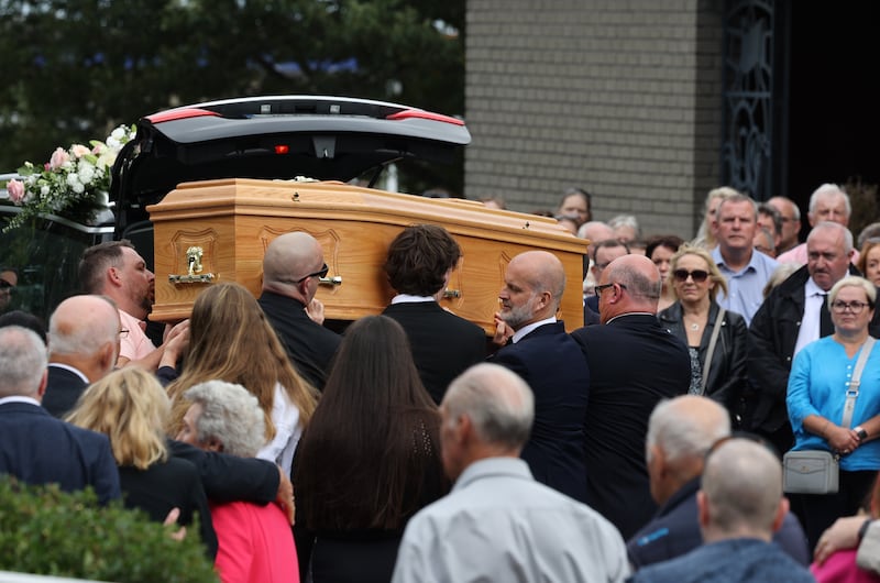 The coffin carrying the remains of Deirdre Finn is taken from the hearse outside St John the Evangelist Church in Ballinteer, Dublin on Friday. Photograph: Nick Bradshaw/The Irish Times