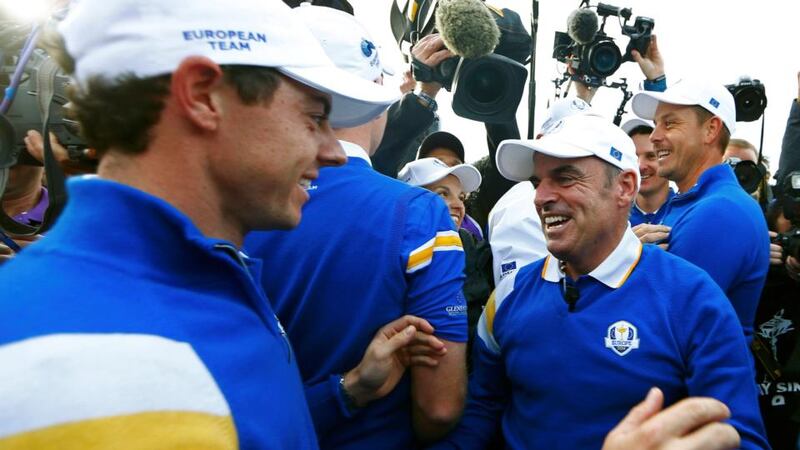 Rory McIlroy (left) and Europe captain Paul McGinley celebrate Jamie Donaldson won   his match against US player Keegan Bradley to retain the Ryder Cup at Gleneagles.  Photograph: Eddie Keogh /Reuters