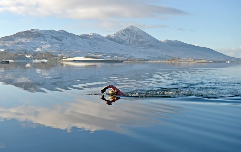 FEELING BLUE: A swimmer braving the elements at The Point, Westport, Co Mayo. Photograph: Conor McKeown / Conor McKeown Photography
