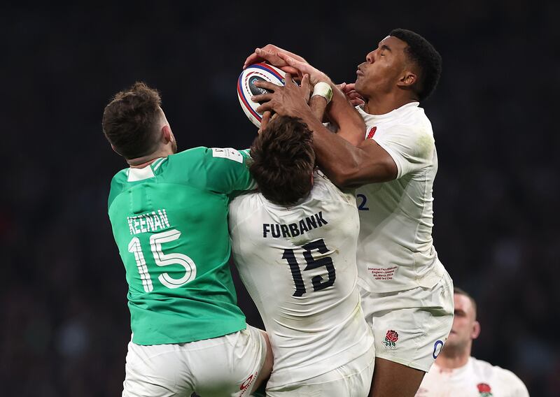 Hugo Keenan of Ireland challenges for a high ball with England's George Furbank and Immanuel Feyi-Waboso during the Guinness Six Nations match at Twickenham. Photograph: Julian Finney/Getty Images
