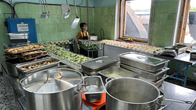 The cooking team of Ukrainian chef Zhenya Mykhailenko working in their Zaporizhzhia kitchen, from where they send thousands of packed meals every week to special forces soldiers along the 1,200km front line. Photograph courtesy of Mary Mykhailenko