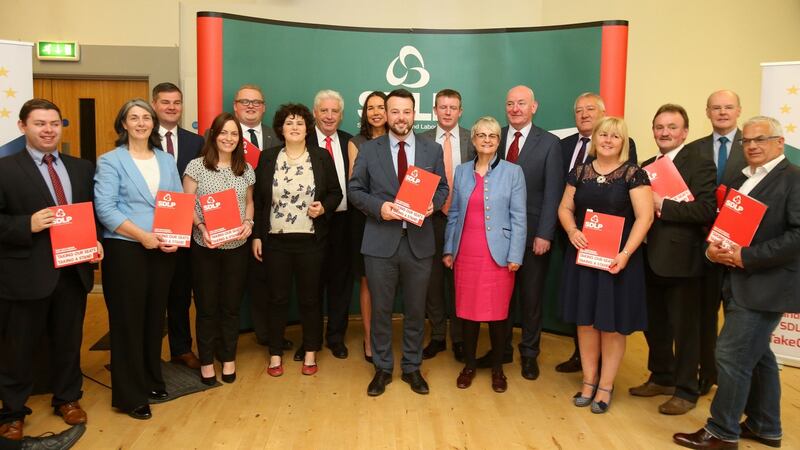 SDLP leader Colum Eastwood with the party’s candidates during the launch of the party’s election manifesto at the Crescent Arts Centre in Belfast.