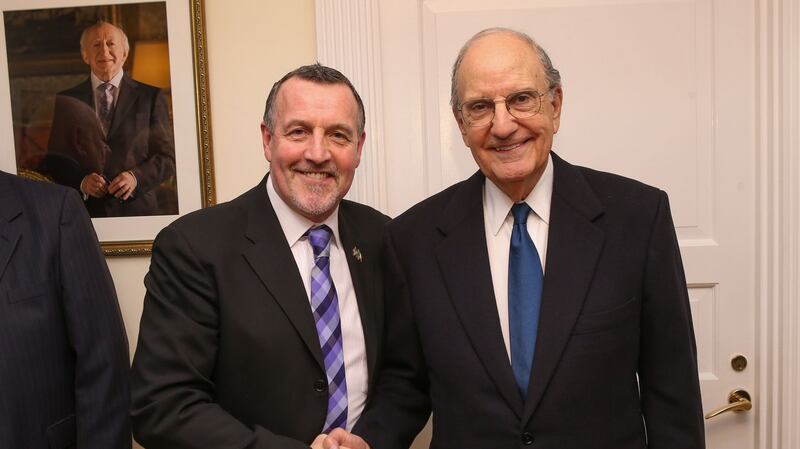 Former INLA prisoner Malachy McAllister with Senator George Mitchell.