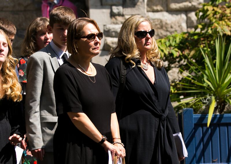 Michael O'Brien's wife Svetlana and daughter-in-law Suzanna
during the funeral. Photograph: Gareth Chaney/ Collins Photos