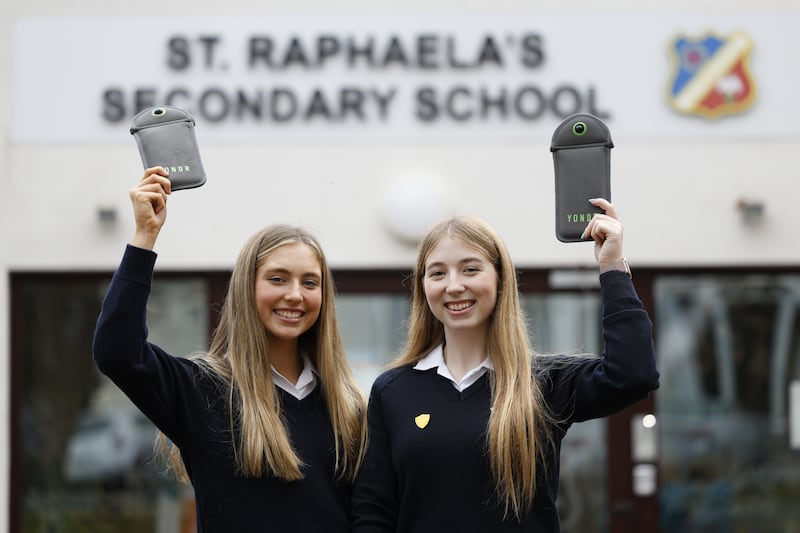 Lara Dardis and Keelin McCarthy at St Raphaela's Secondary School with Yondr pouches. Photograph: Nick Bradshaw