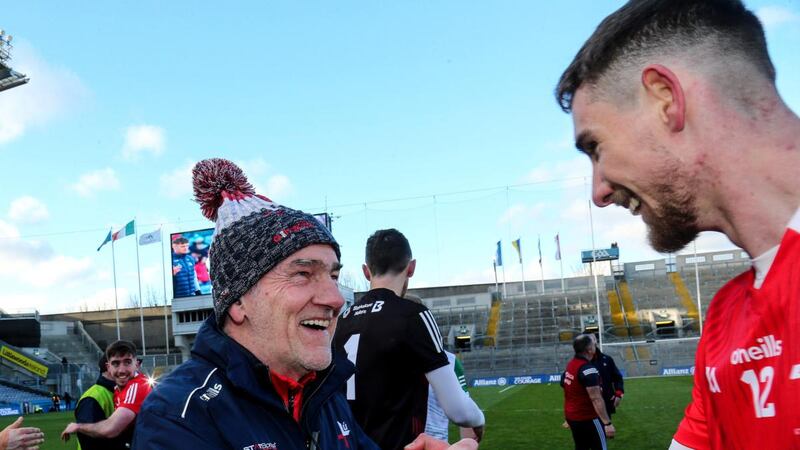 Louth manager  Mickey Harte celebrates with Ciarán Downey after the victory over Limerick in the Allianz Football League Division Three Final at  Croke Park. Photograph: Lorraine O’Sullivan/Inpho