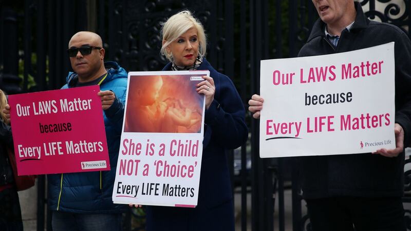 Anti-abortion advocates outside the High Court in Belfast where where a case involving a mother who was prosecuted for securing abortion pills for her daughter was due to take place. Photograph: Brian Lawless/PA Wire.