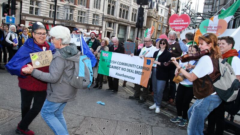 Members of the UK’s Irish Community Campaign Against a No-Deal Brexit play music and dance during the anti-Brexit march in London on Saturday. Photograph: Joanne O’Brien