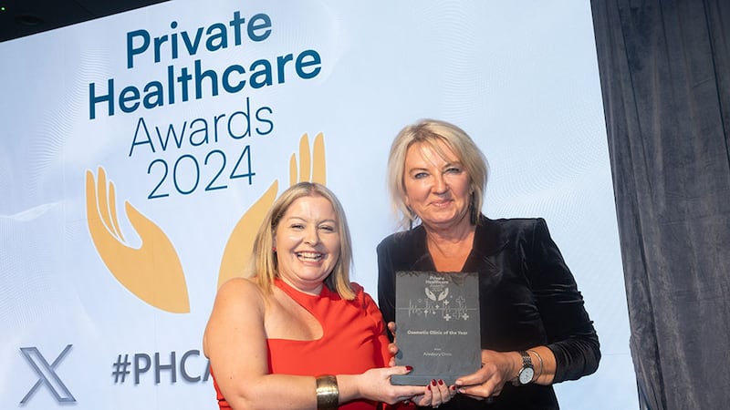 Claudia McGloin, awards judge, presents the cosmetic clinic of the year award to Marie Loftus, Ailesbury Clinic.