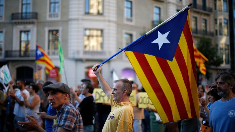 A man holds  the pro-independence Catalan flag during a protest in support of Catalonia’s imprisoned politicians, in Barcelona. Photograph: AP Photo/Manu Fernandez