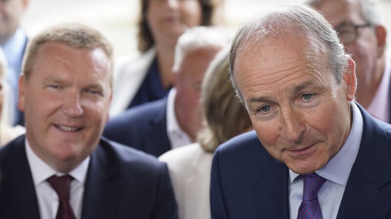 Tánaiste Micheál Martin (right) and Minister for Finance Michael McGrath speak to the media during a Fianna Fáil party event on Monday. Photograph: Niall Carson/PA Wire