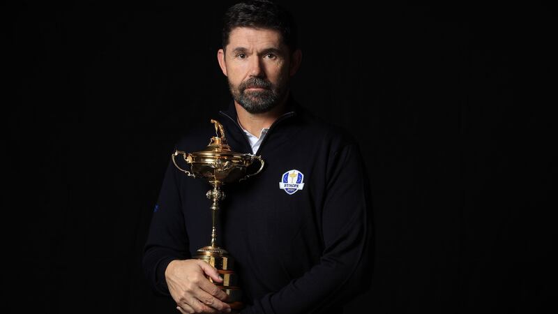 Europe’s Ryder Cup captain  Pádraig Harrington poses with the Ryder Cup trophy. Photograph:  Andrew Redington/Getty Images