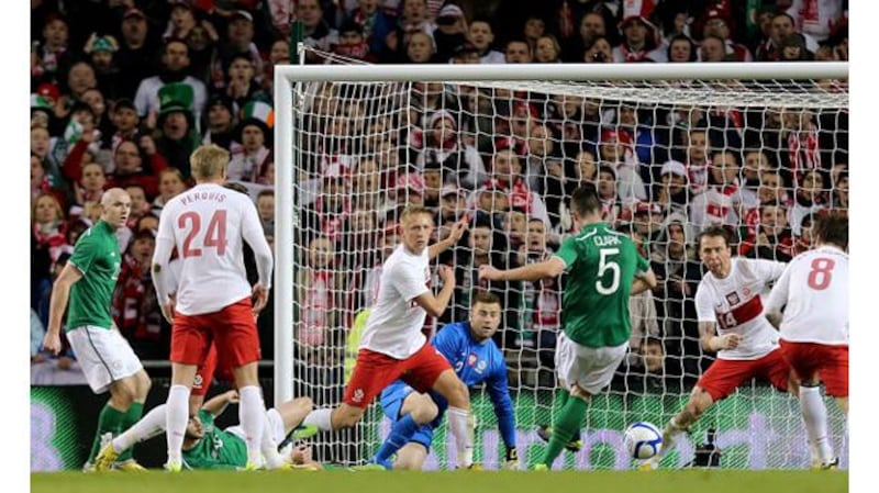 Ciaran Clark scores the opening goal against Poland at the Aviva Stadium. Photograph: James Crombie/Inpho