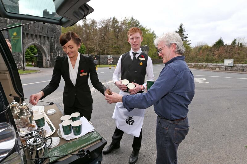 Ashford Castle staff bring hot chocolate and sweets out to the media the day before the wedding itself. Photograph: Colin Keegan/Collins Dublin