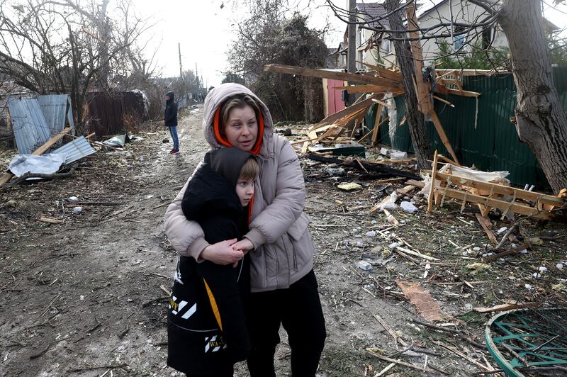 Local residents stand among debris on the street outside a house destroyed as a result of a drone attack in Tairove, Odesa, Ukraine on Sunday. Photograph: Anatolli Stepanov/AFP via Getty