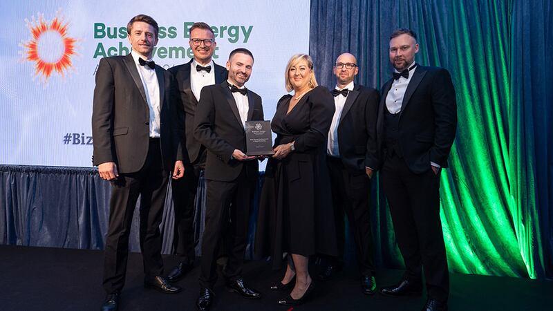 James Carton, awards judge, presents the best energy achievement in manufacturing award to Takeda Ireland Team