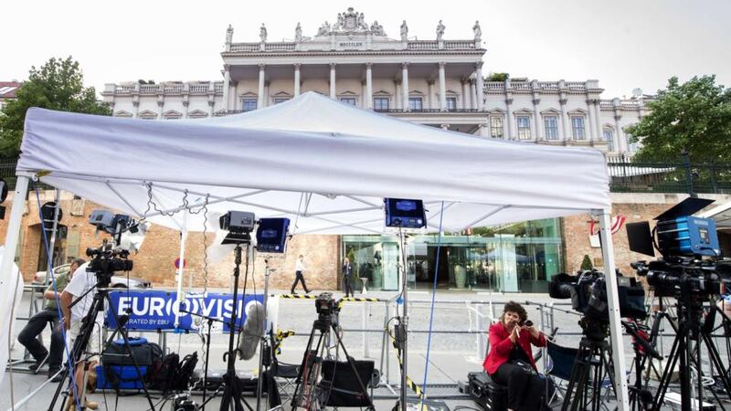 A television journalist fixes her make-up outside the Palais Coburg Hotel in Vienna where  Iran nuclear talks are expected to reach a conclusion on Monday. Photograph: Joe Klamar/AFP/Getty Images.