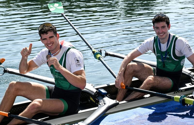 Philip Doyle and Daire Lynch celebrate winning bronze medals at the 2023 World Rowing Championships in Belgrade. Photograph: Detley Seyb/Inpho 