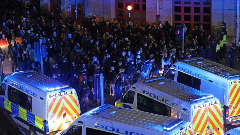 Riot police, with police horses and police vehicles, move towards protesters in Bristol. Photograph: Andrew Matthews/PA Wire