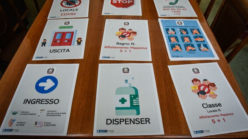 Signs about Covid-19 measures in the Parini high school, in Milan, Italy. Photograph: Matteo Corner/EPA