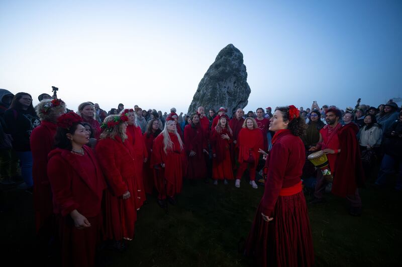 People sing together at Stonehenge on Wednesday morning. Photograph: Finnbarr Webster/Getty