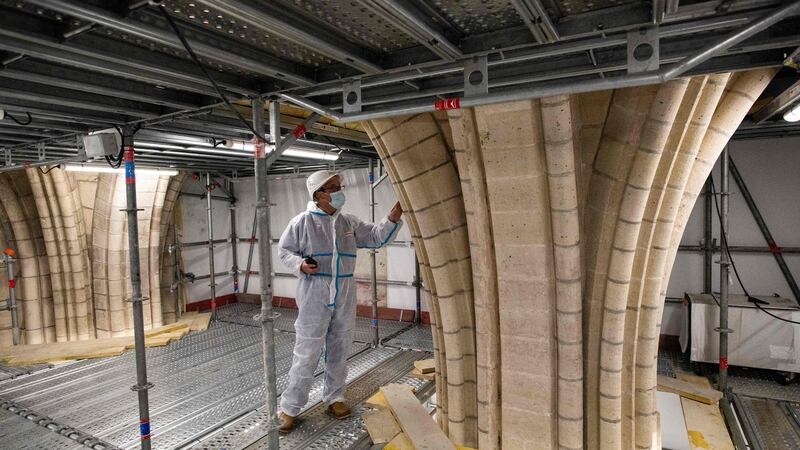 Rector Patrick Chauvet visits Notre-Dame in November  during reconstruction works. Photograph:  Martin Bureau / AFP via Getty