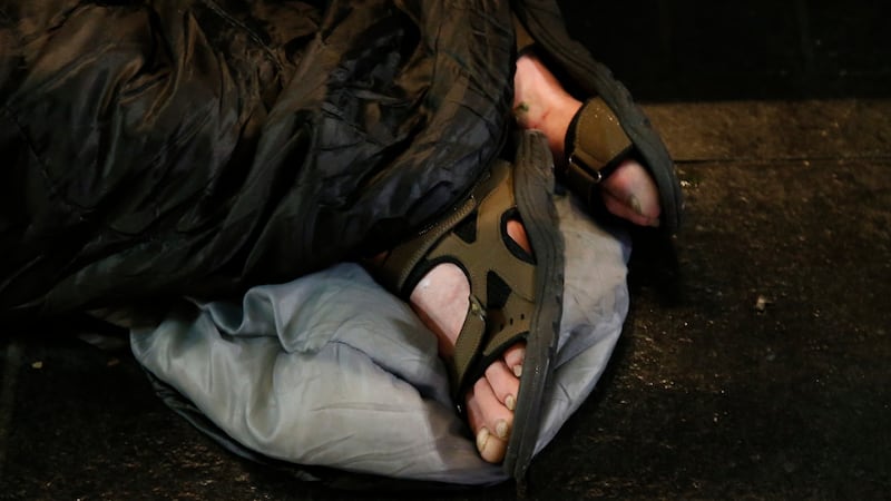 The feet of a rough sleeper seen outside  the GPO on O’Connell Street in Dublin. Photograph: Nick Bradshaw/The Irish Times