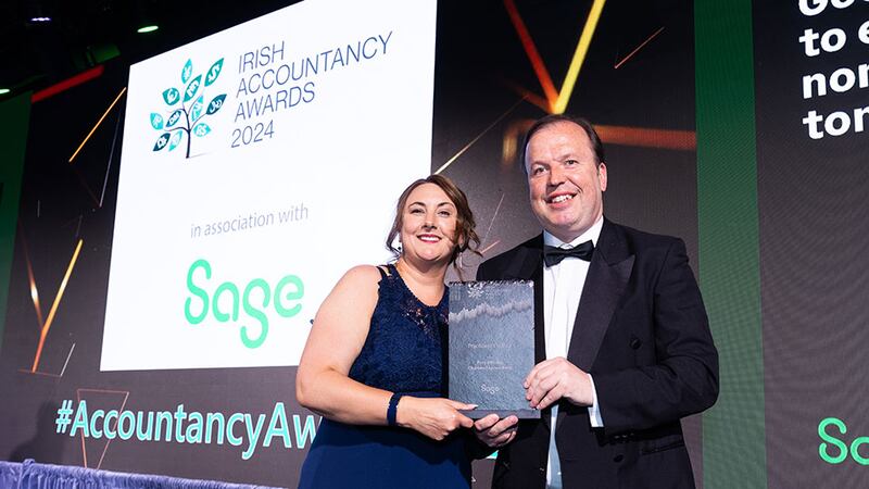 Joanne Gilson, senior sales leader, Sage, presents the practice of the year award to Rory Williams, Rory Williams Chartered Accountants