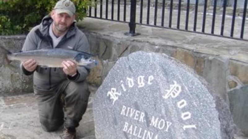 Colin Farrell from Northern Ireland with a fresh salmon of 5kg from the Ridge Pool on the River Moy at Ballina, Co Mayo.