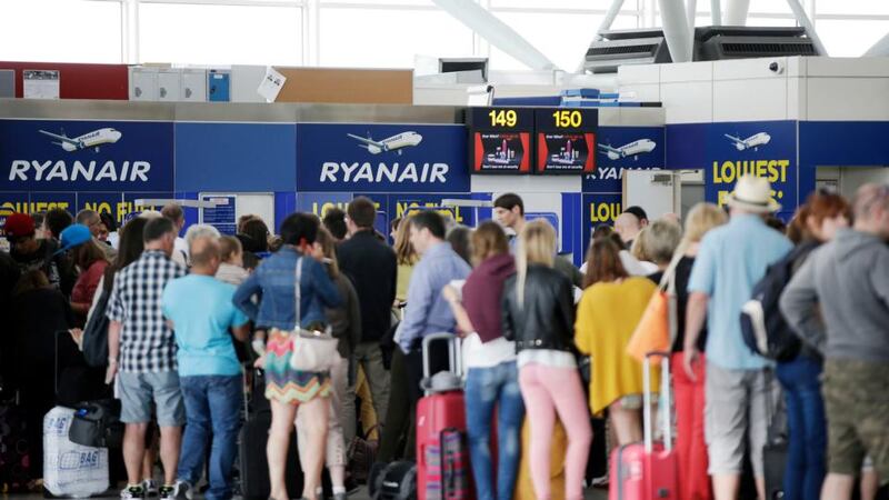 Passengers queue for a flight with Ryanair at Stansted Airport. Photograph: Matthew Lloyd/Bloomberg