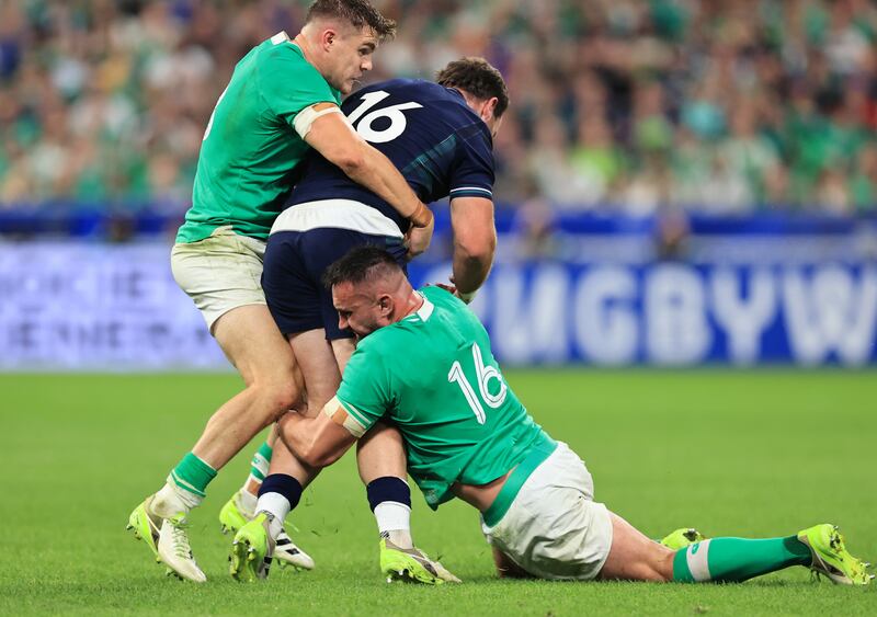 Scotland’s Ewan Ashman is tackled by Ireland’s Garry Ringrose  and Ronan Kelleher. Photograph: Billy Stickland/Inpho