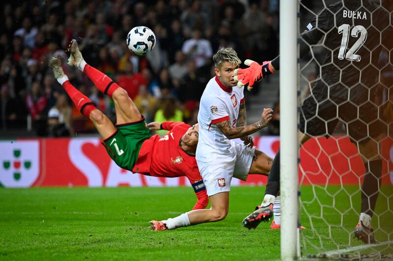 Cristiano Ronaldo scores his second with an overhead kick during the Nations League game against Poland at the Dragao stadium in Porto. Photograph: Miguel Riopa/AFP via Getty Images