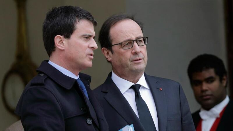 French prime minister Manuel Valls (L) speaks with French president Francois Hollande after a crisis meeting on security at the Elysee Palace in Paris. Photograph: Philippe Wojazer/Reuters.