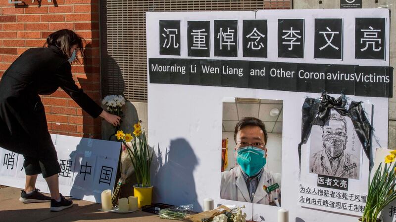 A memorial for Dr Li Wenliang, the whistleblowing doctor who died from the coronavirus in Wuhan, China, outside the UCLA campus in Westwood, California. Photograph:  Mark Ralston/AFP via Getty Images