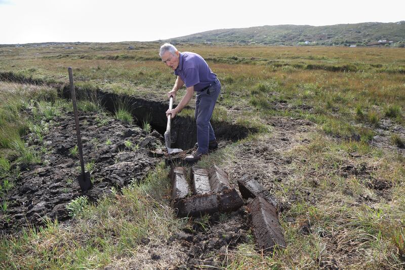 Matt Corbett at work on the bog. Photograph: Joe O'Shaughnessy