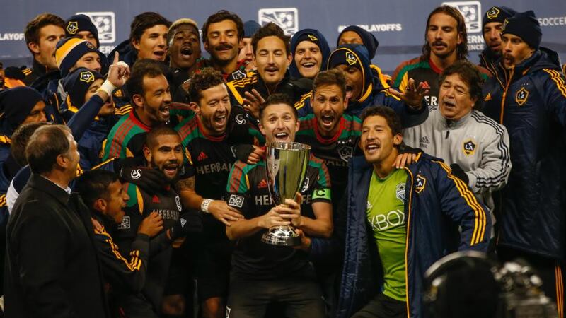 Robbie Keane  of the Los Angeles Galaxy hoists the Western Conference trophy after the Galaxy advanced to the MLS Cup against the Seattle Sounders FC during the Western Conference final on November 30th, 2014. Photograph: Otto Greule Jr/Getty Images