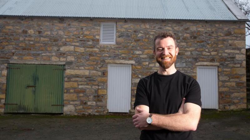 John Butler  at the granary he restored with his father and brother on  the family farm in  Co Leitrim. Photograph: Brian Farrell