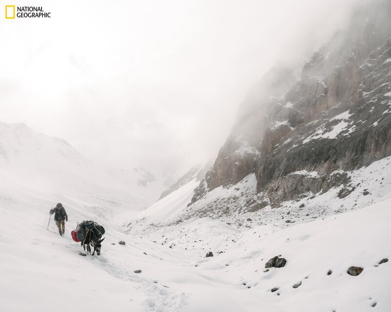 Paul Salopek crossing the Pamir Mountains (also known as the Roof of the World): He speaks eloquently about how human activity has made much of the world uninhabitable. Photograph: Matthieu Paley