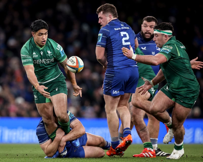 Connacht's Josh Ioane offloads to Denis Buckley during the game against Leinster. Photograph: Ben Brady/Inpho